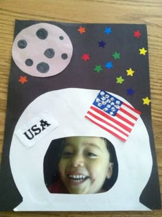 a child's photo in a paper bag with stars and an american flag