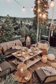 an outdoor patio with wicker furniture and hanging lights