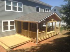 a house with a deck and covered patio