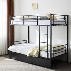 a bunk bed with two sets of mattresses