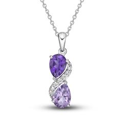 This exquisite necklace features a duo of vibrant pear-cut amethysts in two shades, separated by a swirl of sparkling white lab-created sapphires. Styled in gleaming sterling silver, the pendant sways from an 18-inch cable chain and secures with a lobster clasp. Fine Jewelry Purple Teardrop Pendant Necklace, Purple Teardrop Pendant Fine Necklace, Teardrop Gemstone Accent Necklace For Anniversary, Purple Teardrop Necklace For Formal Occasions, Purple Teardrop Necklace For Formal Events, Elegant Lavender Teardrop Necklace, Elegant Purple Pear-shaped Necklace, Elegant Lavender Drop Necklaces, Teardrop Pendant Necklace With Gemstone Accents For Anniversary