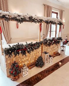 a room decorated with christmas decorations and lights