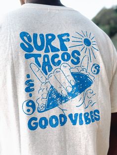 Cozy up in this soft and sustainable tee featuring a relaxed fit and a fun all-over print. Perfect for a day at the beach or a night out on the town. #surf #tacos #goodvibes #hemp . #Clothing_Size_Chart_Design_Ideas #Men_T_Shirts_Design #Surf_Rock_Style #Cool_Graphic_Hoodies Shirts With Designs On The Back, Surfing Tshirt Designs, Men T Shirts Design, Retro T-shirts, Surf Tshirt Design Ideas, Surf Shirt Design, Beach T Shirts Design, Beach Graphic Tee, Retro T Shirt Designs