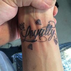 a person with a tattoo on their wrist that says, you're tattofy