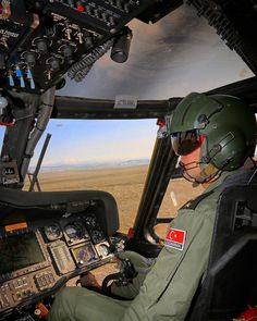 a pilot in the cockpit of an airplane