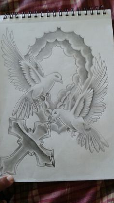 a drawing of two doves with an x on their chest and one holding a cross