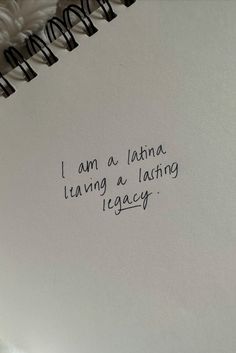 an open notebook with the words i am a latina having a lazing legacy written on it