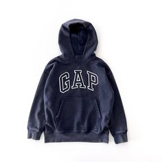 Gap Teen | Size 8 Medium (Measurements Below) Casually Cool Retro Style Pullover Hoodie Gap Arch Logo Applique At Front Soft & Cozy Fleece Knit Long Sleeves Hooded Neckline Kanga Pocket At Front Concealed Cell Phone Pocket. Easy Dropped Shoulders Long Sleeves With Banded Cuffs. Banded Hem. Hits At The Hip Straight Silhouette With A Relaxed Fit Pullover Style Unisex Color: Tapestry Navy (Faded/Broken-In Vintage Blue ) 77% Cotton, 23% Recycled Polyester Machine Wash New With Tags Approx Measurements Flat Lay: Chest Underarm To Underarm 20” Body Length 22” Sleeve Length 23” (From Collar To Cuff) Brand Stock Photo To Highlight Style/Fit Only. About Gap Teen: Planet Friendly Styles Gap Hoodies, Hoodie Gap, Gap Sweatshirt, Star Wars Sweatshirt, Hoodie Aesthetic, Retro Sweatshirts, College Hoodies