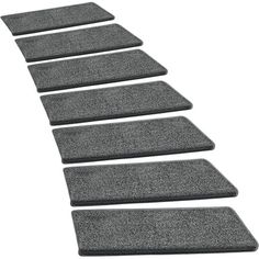 four grey carpeted steps leading up to the top