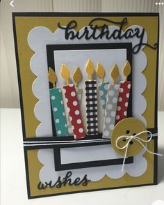 a birthday card with candles on it