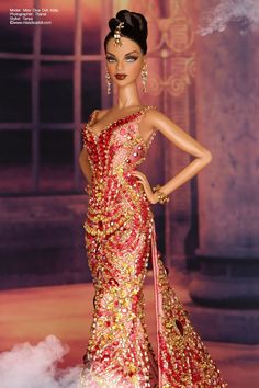 a barbie doll is dressed in red and gold