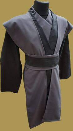 a black robe is shown on a mannequin