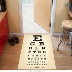 an eye chart rug in the middle of a kitchen