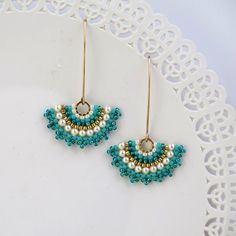 Turquoise and pearl mandala pendant necklace Turquoise & gold Just earrings Turquoise Beaded Dangle Necklaces With Tiny Beads, Turquoise Dangle Beaded Necklaces With Tiny Beads, Handmade Dainty Round Beaded Necklaces, Dainty Handmade Round Beaded Necklaces, Handmade Round Dainty Beaded Necklace, Turquoise Round Beads For Crafting Jewelry, Turquoise Spacer Beads Jewelry For Crafting, Turquoise Pearl Earrings, Long Turquoise Earrings