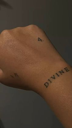 a person's arm with a tattoo on it and the words diving written in cursive font