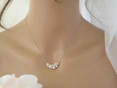 A dainty design that will undoubtedly add sparkle and romantic style to your wedding day look. Focal measures 1 x 0.5 inches. Available in 16 or 18 inch length + a 1 inch extender. Available in Gold or Silver. Items arrive in a beautiful hand decorated gift box. Ready to ship in 3-5 business days. To view this necklace in Silver: https://www.etsy.com/listing/961776386/swarovski-crystal-necklace-simple-bridal?ref=shop_home_active_3&frs=1 To view coordinating earrings: https://www.etsy.com/lis Dainty Gold Rhinestone Necklace For Wedding, Dainty Gold Rhinestone Wedding Necklace, Pearl Wedding Necklace, Black Statement Earrings, Black Crystal Earrings, Asymmetrical Necklace, Simple Pearl Necklace, Gold Bridal Necklace, Pearl Necklace Wedding