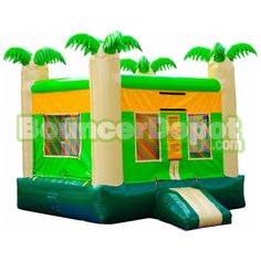 an inflatable bounce house with palm trees