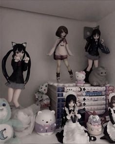 there are many figurines on the shelf