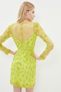 Get set to mesmerise in this arresting lime-green mini dress. A captivating concoction of beads, sequins and mesh make this chic column style a must-have for special soirees. Semi-sheer embellished panelling framing the neckline and sleeves add a delicate touch to the dress.Style: Bodycon DressFabric: Fancy FabricLength: MiniNeckline: High NeckSleeve Length: Long Sleeve Green Mini Dress, Girls Dream, Dress Collection, Lime Green, The Dress, Long Sleeve Dress, Mesh, Mini Dress, Beads