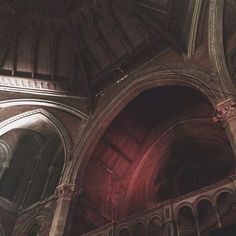 the interior of an old church with stone arches