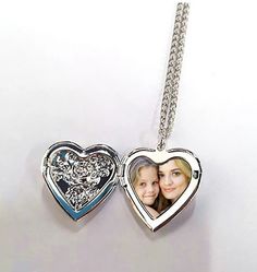 -    This Personalised Silver Heart Photo Locket & Necklace is a stunning gift for her on any occasion. -    The length of the chain is approx 18 inches with a lobster clasp. -    The locket measures approx 3.0cm high x 2.52cm wide -    The locket is personalised with a photo. -    A perfect gift for Valentine's Day, Weddings, Anniversaries, Birthdays, Mother's Day. -    Send your photo using the message seller function - dont forget to include your buyer details / username Mother's Day Pendant Locket Necklace With Adjustable Chain, Locket Necklace For Her - Mother's Day Gift, Locket Necklace For Mother's Day Gift, Heart Locket Necklace With Chain For Anniversary, Adjustable Chain Locket Necklace For Anniversary On Mother's Day, Adjustable Open Heart Locket Necklace As Gift, Open Heart Locket Necklace With Adjustable Chain As Gift, Open Heart Locket Necklace With Adjustable Chain, Valentine's Day Heart Locket Necklace