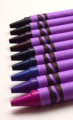 six purple and black pens with zebra print on them