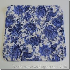 a blue and white tray with flowers on it