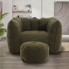 a green chair and ottoman in a room