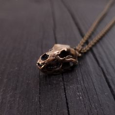 This three dimensional grizzly bear skull pendant necklace is cast in solid jewelers grade bronze and is perfectly proportional. It has been oxidized dark in the recesses to enhance the refined details of this beautiful piece. The skull has an overall length of 1" and is 5/8" across at its widest point. Bronze Skull-shaped Jewelry Gift, Bronze Skull Jewelry For Gifts, Bronze Skull Jewelry Gift, Grizzly Bear Skull, Bear Skull, Button Studs, Wolf Face, Skull Pendant Necklace, Wolf Jewelry