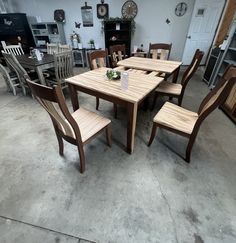 a wooden table and chairs in a room