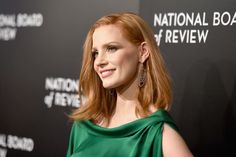 a woman in a green dress at the national board of review awards