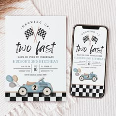 two fast birthday party cards with race car and balloons on the front, next to an iphone