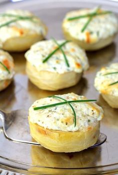 small appetizers with cheese and herbs on a metal tray, ready to be eaten