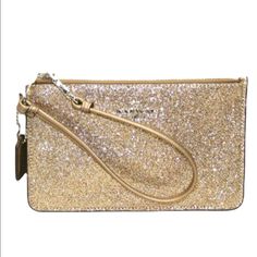 A Lil’ Cute Essential Color: Champagne Gold Coach Emblem On Front Two Interior Card Slots Zip Closure Glitter Texture On Front Side Only Leather Material Approx. Size 4 1/4”H X 7”W X 1/8”D Approx. Strap Drop 6” Plz Adjust For Lighting No Trades Free Gift W/Purchase Same-Day Shipping Eyeit-Buyit Coach Gold Rectangular Wristlet, Gold Rectangular Coach Wristlet, Elegant Gold Coach Wristlet, Coach Gold Clutch Wristlet, Gold Coach Clutch Wristlet, Elegant Gold Wristlet For Evening, Coach Clutch Wristlet For Evening, Elegant Gold Clutch Wristlet, Gold Wristlet For Parties