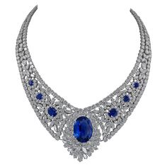 A stunning necklace featuring a 30.16 oval sapphire in the center. The sapphire is certified by GRS Lab, stating that it's a natural gemstone of Sri Lanka origin with the indication of heat. The necklace is embellished with 6 smaller oval sapphires on the sides, an oval sapphire clasp and circular and marquise diamonds. The total weight of diamonds is 100 carats. The diamonds are not certified and are equivalent to F-G-H colors, VS clarity. An appraisal is available upon request. The setting is Sapphire Diamond Necklace, White Diamond Necklace, Diamond Tiara, Ceylon Sapphire, Heart Pendant Gold, Necklace Diamond, Necklace Craft, Tourmaline Necklace, Expensive Jewelry