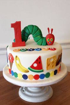 Very Hungry Caterpillar Cake | Very Hungry Caterpillar Party Ideas One Hungry Caterpillar, 1st Birthday Boy Themes, Very Hungry Caterpillar Party, Very Hungry Caterpillar Birthday, Caterpillar Cake, Birthday Cake Recipes, Caterpillar Party, Hungry Caterpillar Party