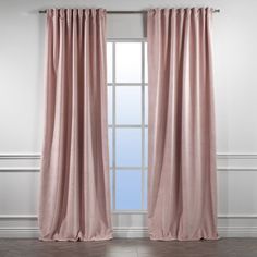 a pink curtain hanging on the side of a window in front of a white wall