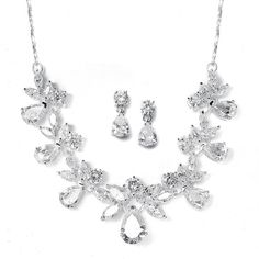 CZ Bridal Jewelry Set 578SThis glistening bridal necklace and earrings set in silver plating will be an elegant accessory for your wedding day. It features brilliant teardrop, round and marquise cubic zirconia crystals to make a beautiful bridal or prom accessory. A delicately twisted rose gold chain completes the look.Size: Necklace extends from 15" to 18" long. The dainty pierced CZ drop earrings measure 3/4" long.Color: Silver.Style: 578S.Perfect for weddings, proms, homecoming and quinceaner Green Sapphire Earrings, Winter Bridal Jewelry, Gold Diamond Hoop Earrings, Black Diamond Earrings, Bridal Accessories Jewelry, Bridal Jewelry Set, Nickel Free Earrings, Bridesmaid Jewelry Sets, Cz Necklace