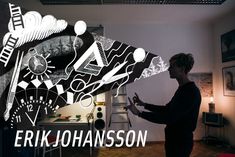 a man standing in front of a painting with the words eric johnsson on it