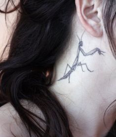 a woman with a tattoo on her neck