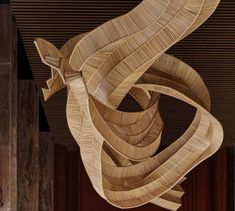 a large wooden sculpture hanging from the ceiling