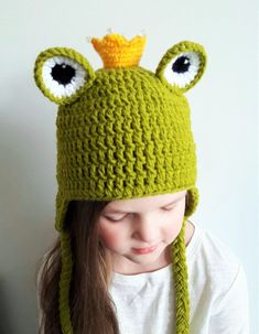 "Cute crochet FROG earflap hat with braids and crown on top. Fun hat for kids from babies, toddlers up to teens and for women as well. Hat- eye catcher. Put on your frog hat and stand out from the crowd! :) It is crocheted seamlessly in the round with eye appliques sewn onto and crown with plastic \"jewels\". (add a note if yu would like hat without beads) Materials- wool acrylic blended yarn, plastic beads for crown. Color- Green with yellow. *Real colors may slightly differ due to current yarn Cute Crochet Frog, Crochet Frog Hat, Hat With Braids, Princess Frog, Frog Hat, Frog Princess, Outfit Costume, Earflap Hat, Crochet Frog