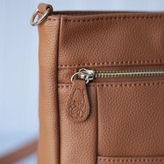 This small crossbody carry is the perfect size to take all your essentials with you on the go without sacrificing organization or space. Perfect for date night, running errands sans kiddos, or a girls’ night out, The McKenna is crafted with our luxurious vegan leather with Lily Jade quality enhanced durability and plush stain and water-resistant liner and comes with a one-year structural warranty and a 6-month vegan leather warranty. Pockets: Front slip: 6.75"(W)x4.75"(D) Front zip; 7.5"x7.5" On Everyday Crossbody Satchel With Cell Phone Pocket, Lily Jade, Rebecca Minkoff Mac, Small Crossbody, Girls Night Out, Girls Night, Running Errands, Leather Backpack, The Go