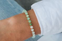 "Chrysoprase opens, activates and energises the heart and sacral chakras, balances yin-yang energy, and brings Universal energy into the physical body. It induces deep meditative states, and imparts a sense of being a part of the divine whole. Chrysoprase promotes love of truth. D E T A I L S △ Handmade in Canada △ Genuine Chrysoprase 4.5-5mm △ 14K gold filled accents △ Gemstones are 100% genuine  L E N G T H Please measure your wrist then add 1/2\" to find your best fit. Select chosen size in t Green Dainty Beaded Bracelets With Natural Stones, Dainty Green Beaded Bracelets With Natural Stones, Dainty Green Beaded Bracelet With Natural Stones, Dainty Green Gemstone Beaded Bracelets, Dainty Green Hand-strung Beaded Bracelets, Green Amazonite Beaded Bracelets As Gift, Everyday Green Stretch Bracelet With 8mm Beads, Everyday Green Jade Beaded Bracelets, Green Amazonite Gemstone Beaded Bracelets