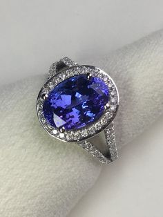 4.02 carat Natural Tanzanite and 0.44 carats Natural Diamonds | Etsy Luxury Tanzanite Diamond Ring With Halo Setting, Formal Tanzanite Round Cut Diamond Ring, Formal Tanzanite Diamond Ring With Round Cut, Formal Tanzanite Fine Jewelry Rings, Tanzanite Brilliant Cut Formal Rings, Classic Tanzanite Diamond Ring In White Gold, Exquisite White Gold Tanzanite Ring, Luxury Tanzanite Diamond Ring, Timeless Tanzanite Ring With Prong Setting