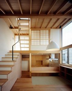 an instagramted photo of a japanese house with stairs and wood paneled walls