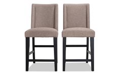 two beige upholstered barstools with dark wood legs and backrests