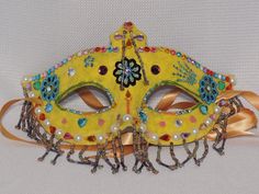 "Beaded masquerade ball mask OOAK - Mardi Gras - Carnival - Halloween - costume mask These wonderful & whimsical beaded masks are handcrafted & all each one is a unique and One of a Kind (OOAK) piece. These are not only great as art to be displayed on a wall or shelf, but also made sturdy enough to be used for costume purpose. One size fits most adults These masks are created using mask blanks that I have covered with several layers of tissue paper & decoupage. They have been further Handmade Masquerade Mask For Halloween Cosplay, Handmade Halloween Festival Masquerade Mask, Gold Masquerade Mask For Carnival Cosplay, Handmade Fantasy Masquerade Mask For Costume Party, Gold Costume Accessories For Cosplay Events, Fantasy Masks And Prosthetics For Carnival Festival, Handmade Costume Accessories For Halloween Masquerade, Masquerade Eye Mask For Cosplay Events, Halloween Festival Masquerade Eye Mask