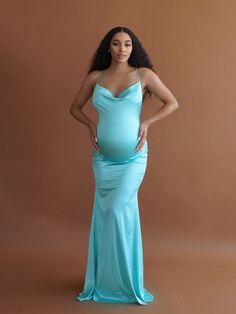 Our model is 5'7 wearing a Small Cassie has finally arrived with her draped bust line, Figure-hugging silhouette, and glamorous crossed-back spaghetti straps, she is guaranteed to have you looking & feeling like the belle of the ball. Perfect for a baby shower, pregnant wedding guest, or pregnancy photoshoot. The Cassie Gown is extremely soft stretch satin look fabric with adjustable crossed straps. Evening Dresses With Adjustable Straps And Low Back, Fitted Dress With Adjustable Straps And Low Back, Elegant Low Back Slip Dress With Adjustable Straps, Sleeveless Gown With Ruched Back For Prom, Elegant Slip Dress With Adjustable Straps And Low Back, Elegant Wedding Dress With Crisscross Straps And Strappy Back, Strappy Back Dress With Crisscross Straps For Gala, Gala Dress With Crisscross Strappy Back, Gala Dress With Crisscross Straps And Strappy Back