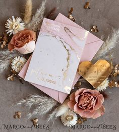 pink and gold wedding stationery with dried flowers on the side by margo & bee's photography